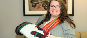 Megan Ellis, Indigenous Program Coordinator, has been leading the KAIROS Blanket Exercise with groups of staff from The Ottawa Hospital. She wears her red sash to show her Métis heritage.